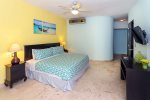 Master suite with king bed, TV and ocean view